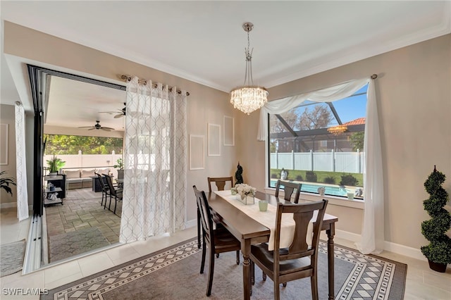 tiled dining space with crown molding and ceiling fan with notable chandelier