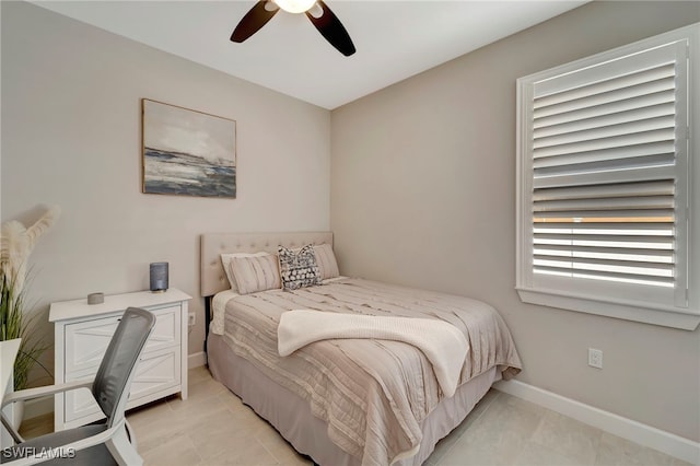 bedroom with light tile patterned floors and ceiling fan