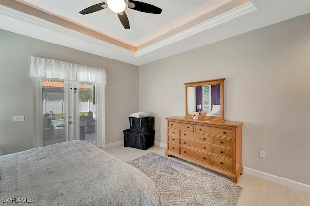 bedroom with access to outside, a tray ceiling, crown molding, and ceiling fan