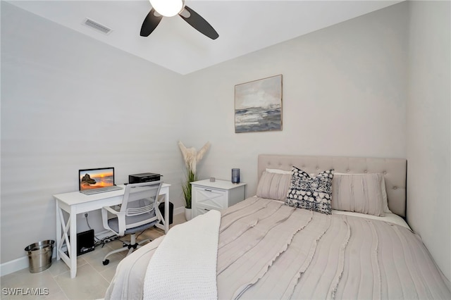 tiled bedroom with ceiling fan