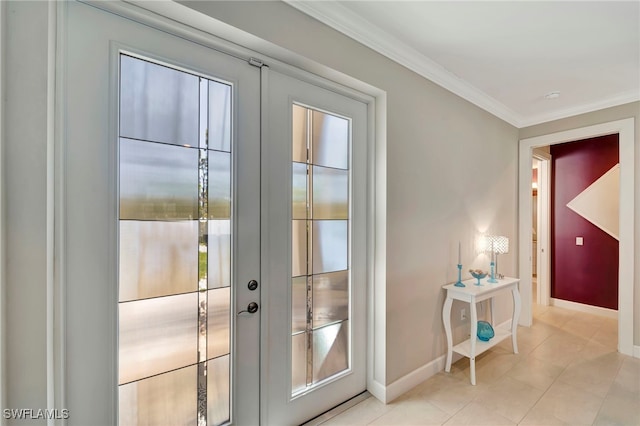 entryway with french doors, crown molding, and light tile patterned floors