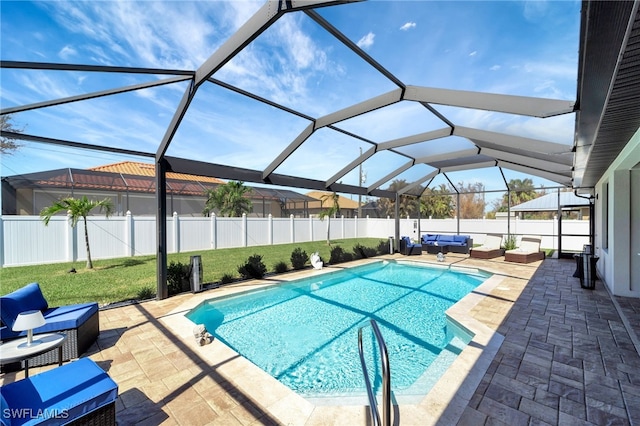 view of pool with a patio and glass enclosure