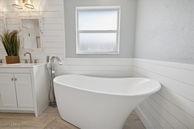 bathroom featuring vanity and a bathtub