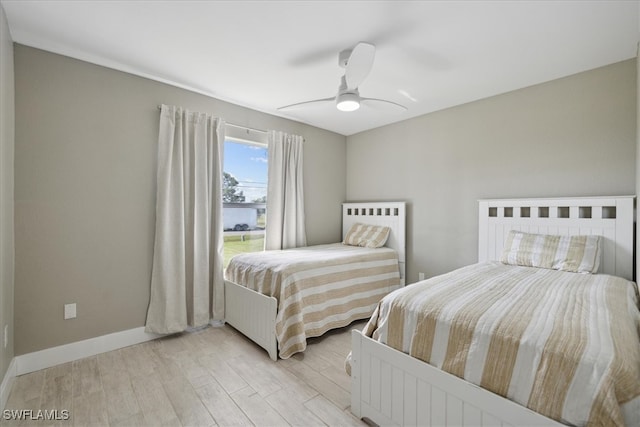 bedroom featuring light hardwood / wood-style floors and ceiling fan