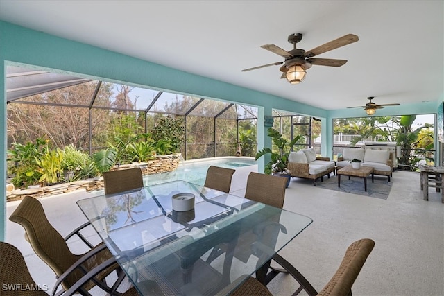 view of patio / terrace featuring a hot tub, ceiling fan, outdoor lounge area, and glass enclosure