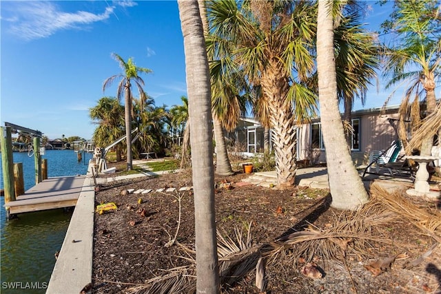 20 Sunview Blvd, Fort Myers Beach, FL 33931 - view of yard with a boat dock and a water view