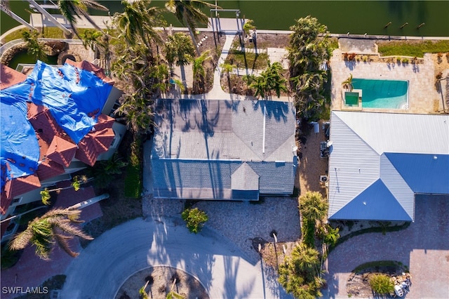 birds eye view of property featuring a water view