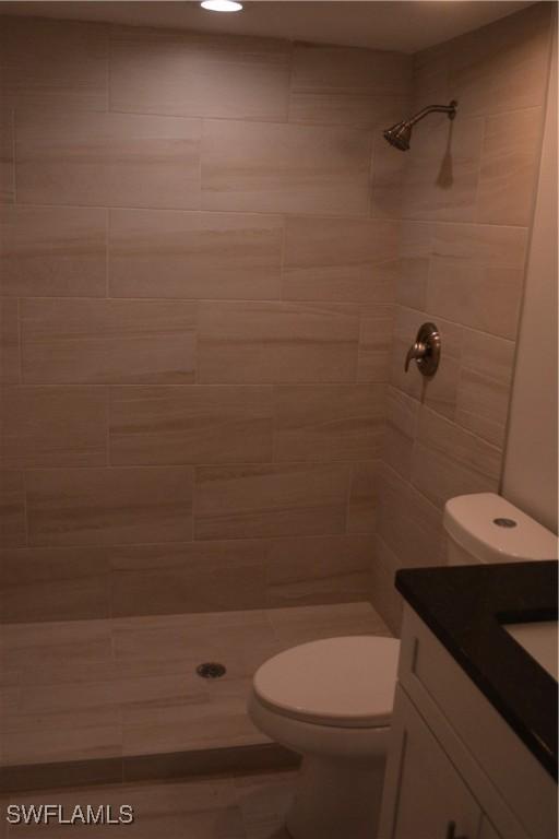 4229 SE 19th Pl Unit 1D, Cape Coral, FL 33904 - full bath featuring vanity, a tile shower, and toilet