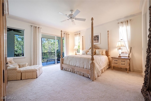 carpeted bedroom with ceiling fan, ornamental molding, and access to exterior