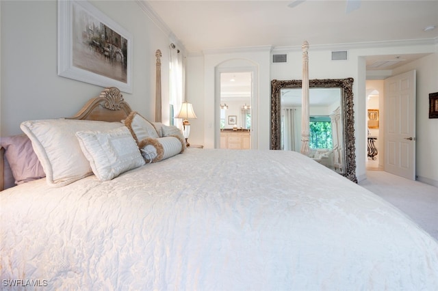 carpeted bedroom featuring crown molding and ceiling fan