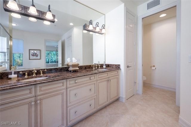 2843 Tiburon Blvd E Unit 7-102, Naples, FL 34109 - full bath featuring toilet, double vanity, recessed lighting, tile patterned flooring, and baseboards