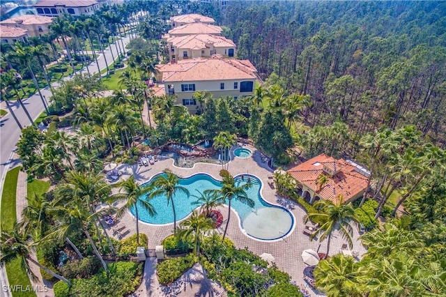 2843 Tiburon Blvd E Unit 7-102, Naples, FL 34109 - bird's eye view of a heavily wooded area and a pool area