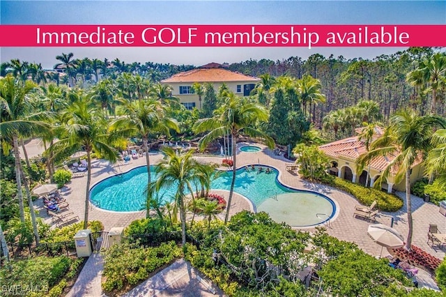 2843 Tiburon Blvd E Unit 7-102, Naples, FL 34109 - community pool with a community hot tub, fence, a gate, and a patio