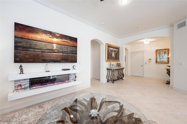 living room with ornamental molding and light tile patterned flooring