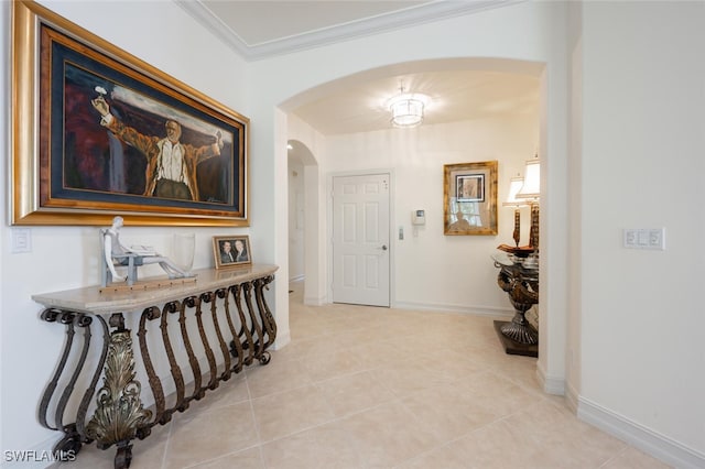 corridor with crown molding and light tile patterned floors