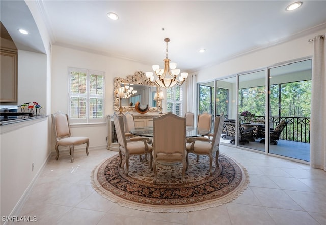 tiled dining area featuring ornamental molding and a notable chandelier