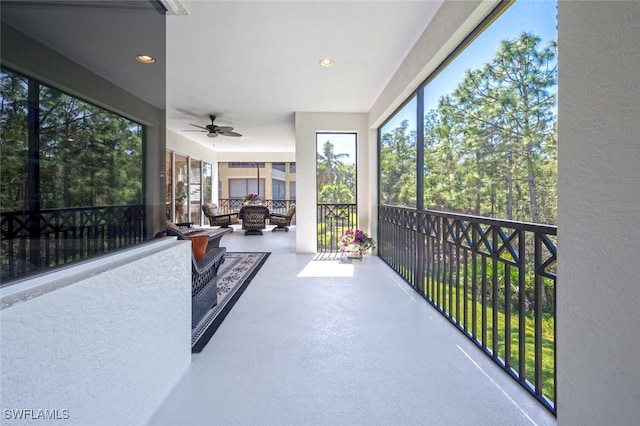 2843 Tiburon Blvd E Unit 7-102, Naples, FL 34109 - unfurnished sunroom featuring ceiling fan and plenty of natural light