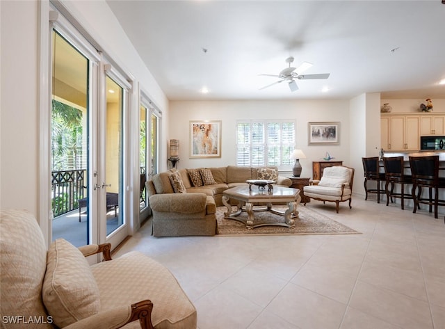 2843 Tiburon Blvd E Unit 7-102, Naples, FL 34109 - living room with light tile patterned floors, a ceiling fan, and recessed lighting