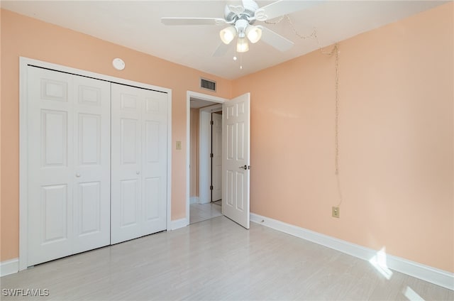 unfurnished bedroom with a closet and ceiling fan