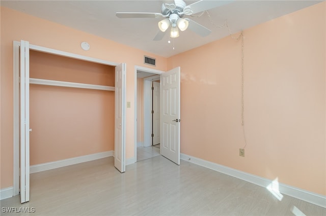 unfurnished bedroom with a closet and ceiling fan