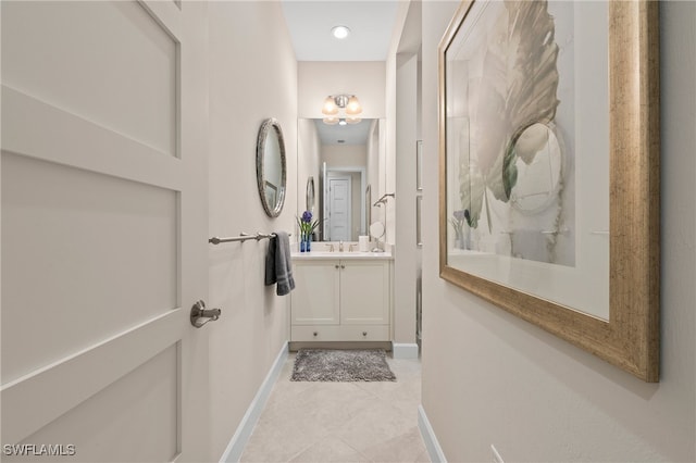 bathroom featuring vanity, a shower, and tile patterned flooring