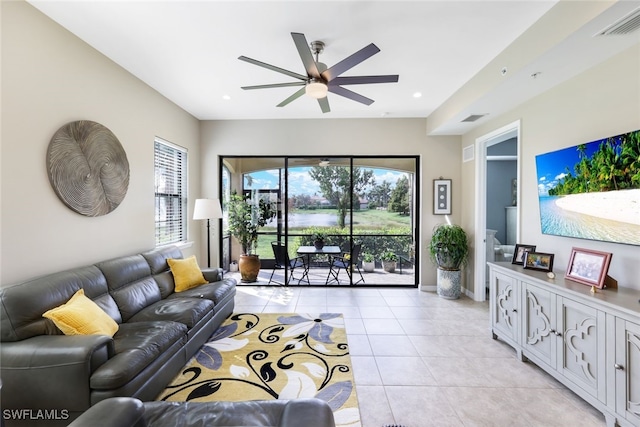 tiled living room with ceiling fan