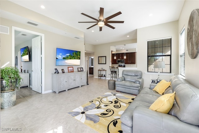 living room featuring ceiling fan