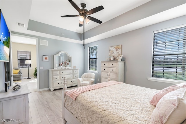 bedroom featuring light hardwood / wood-style floors and ceiling fan