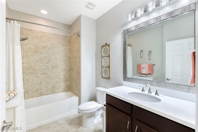 full bathroom with tile patterned floors, vanity, toilet, and shower / bath combo with shower curtain