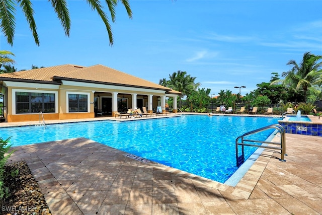 view of swimming pool with a patio