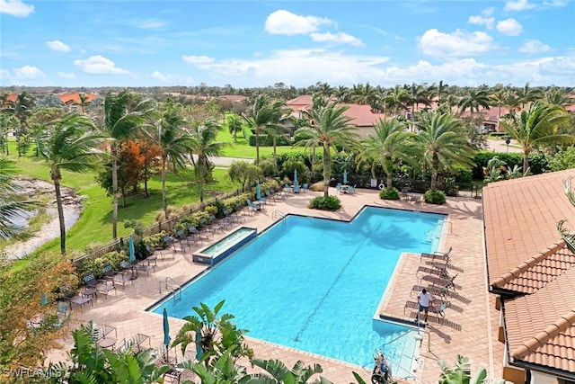 view of swimming pool with a patio