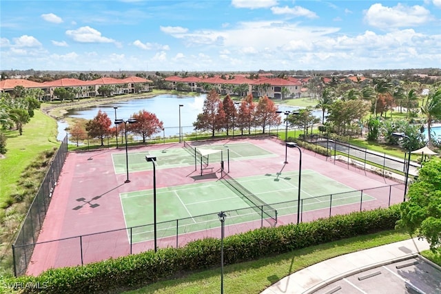 view of sport court with a water view