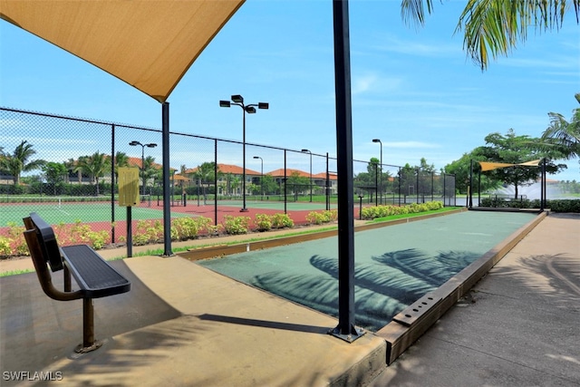 view of community with tennis court