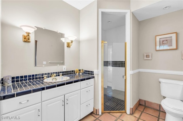 685 11th St NW, Naples, FL 34120 - bathroom with toilet, a stall shower, vanity, and tile patterned flooring