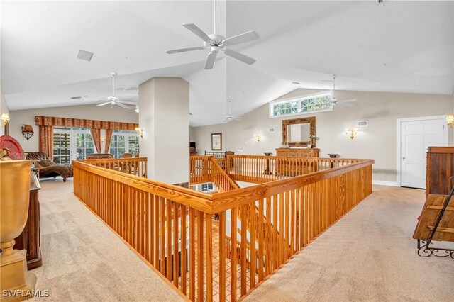 685 11th St NW, Naples, FL 34120 - hallway featuring lofted ceiling, light carpet, and an upstairs landing