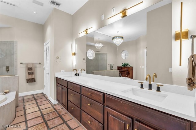 685 11th St NW, Naples, FL 34120 - full bathroom with double vanity, baseboards, walk in shower, and a bathtub