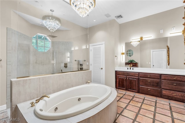 bathroom featuring vanity, a chandelier, separate shower and tub, and tile patterned floors