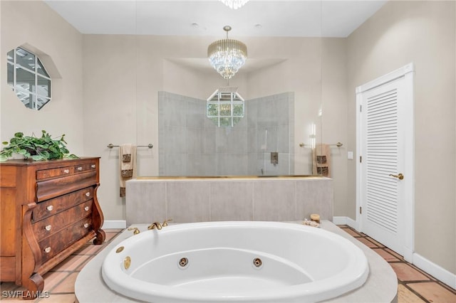 685 11th St NW, Naples, FL 34120 - full bath featuring a whirlpool tub, a walk in shower, baseboards, and a chandelier