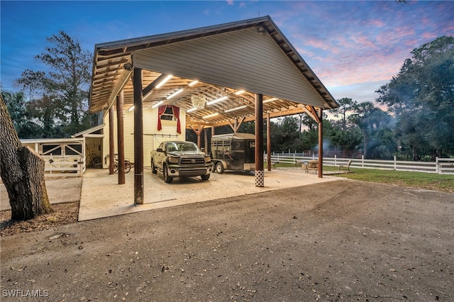 view of parking at dusk