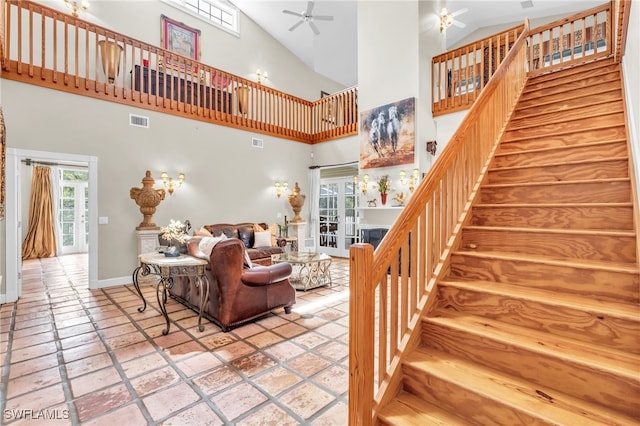 living room featuring ceiling fan and high vaulted ceiling