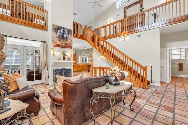 living room featuring french doors, high vaulted ceiling, and ceiling fan