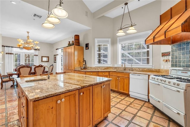 685 11th St NW, Naples, FL 34120 - kitchen featuring white appliances, custom exhaust hood, a chandelier, a sink, and plenty of natural light