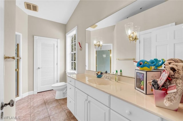 685 11th St NW, Naples, FL 34120 - full bath featuring a chandelier, vaulted ceiling, vanity, tile patterned floors, and toilet