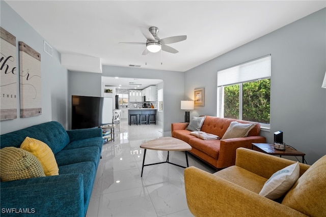 living room with ceiling fan