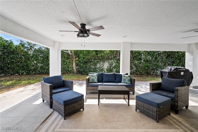 view of patio with ceiling fan, grilling area, and an outdoor living space