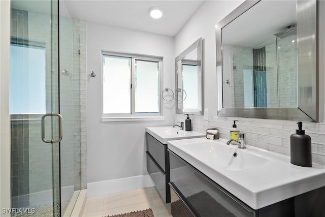 bathroom with a shower with door, vanity, backsplash, and tile patterned flooring