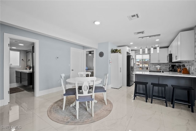 dining space with sink