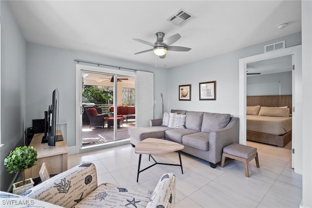 living room featuring light tile patterned flooring and ceiling fan