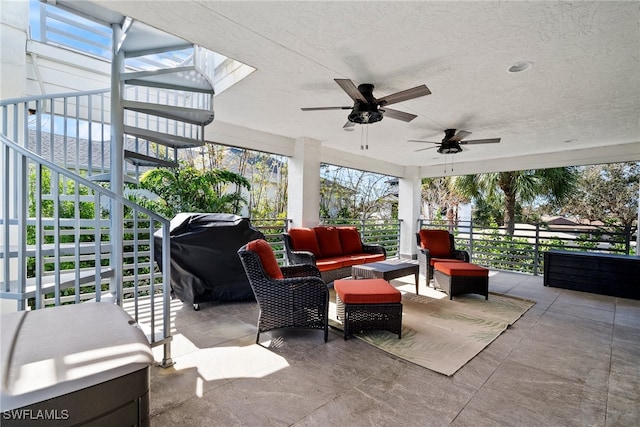 view of patio / terrace with outdoor lounge area, grilling area, and ceiling fan