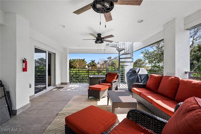 view of patio with an outdoor living space and ceiling fan